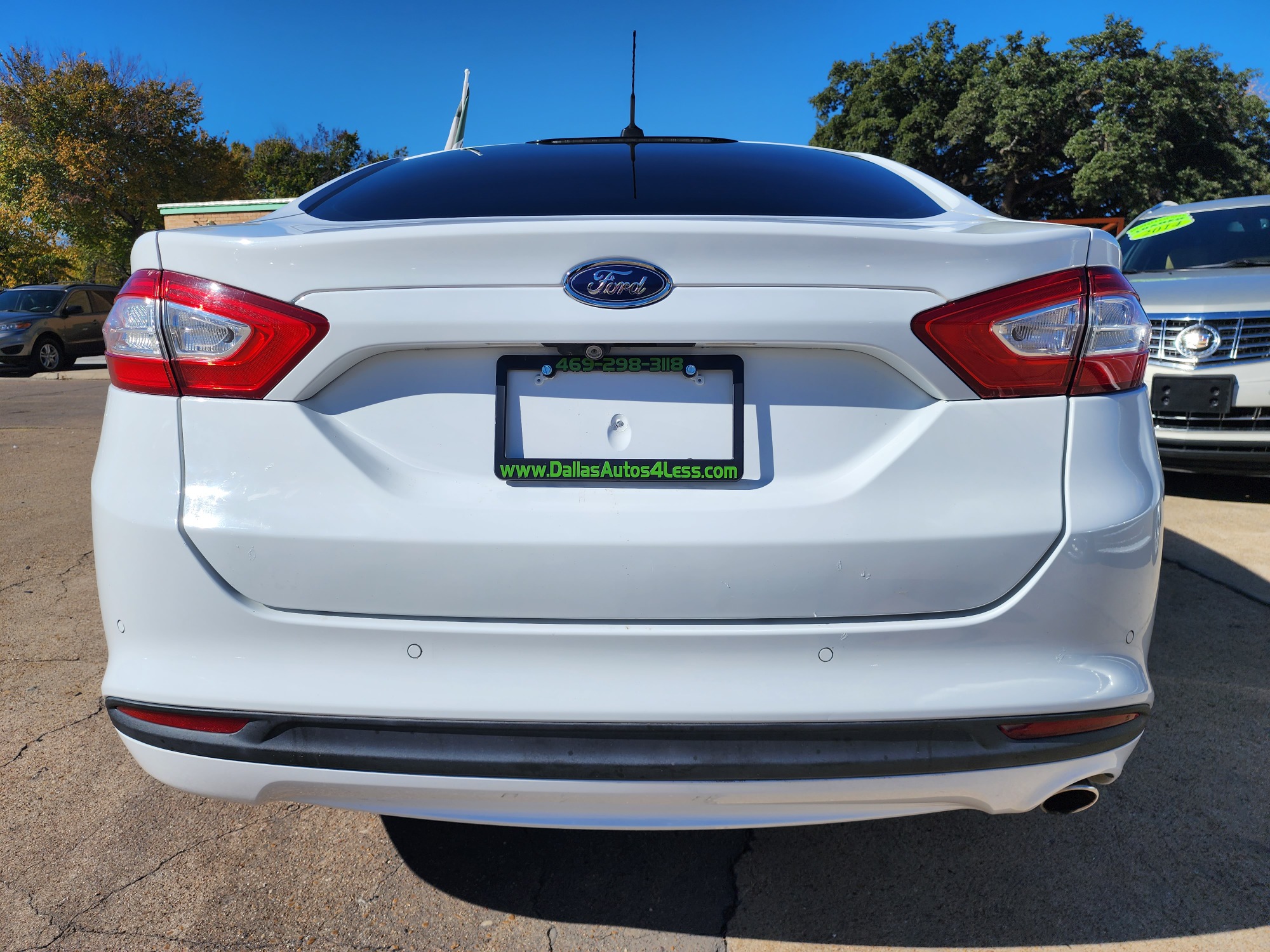 2015 WHITE Ford Fusion Hybrid S (3FA6P0UU3FR) with an 2.0L L4 DOHC 16V HYBRID engine, CVT transmission, located at 2660 S.Garland Avenue, Garland, TX, 75041, (469) 298-3118, 32.885551, -96.655602 - Welcome to DallasAutos4Less, one of the Premier BUY HERE PAY HERE Dealers in the North Dallas Area. We specialize in financing to people with NO CREDIT or BAD CREDIT. We need proof of income, proof of residence, and a ID. Come buy your new car from us today!! This is a 2015 FORD FUSION HYBRID S L - Photo #4